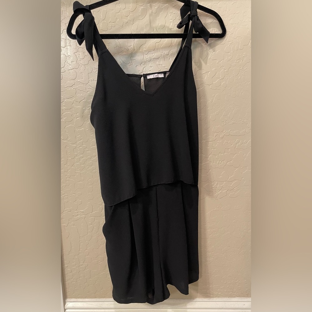 Adorable black one piece short outfit. Size small.